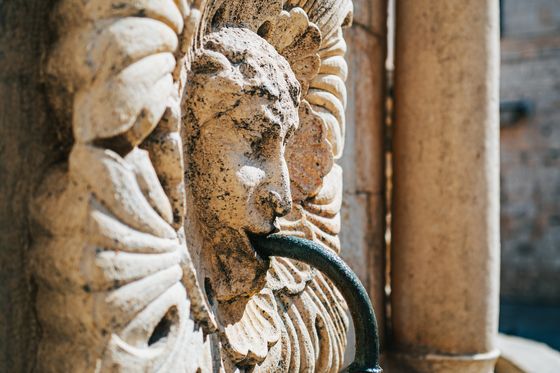 a stone fountain carving in dubrovnik croatia