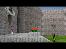 A screenshot of Link meeting with a young Princess Zelda in the Hyrule Castle Courtyard.