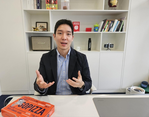 This photo, taken June 27, 2024, shows Jay Lim, founder and global CEO of GOPIZZA, talking about the company's overseas business plans at the single-serving pizza firm's headquarters in Jongno, Seoul. (Yonhap)
