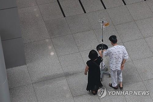 A patient walks inside a general hospital in Seoul on July 7, 2024, amid the prolonged walkout by trainee doctors. (Yonhap)