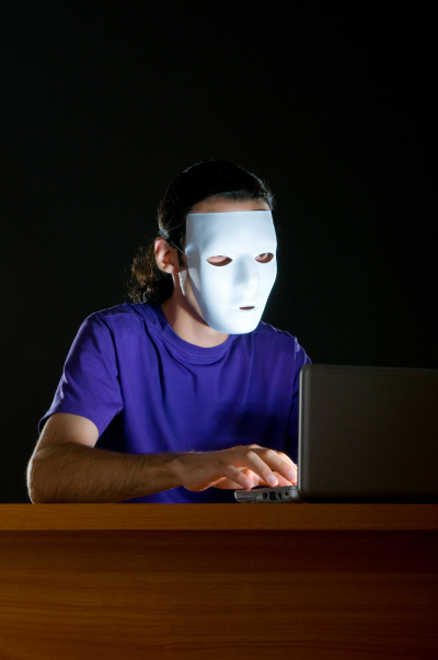 Hacker sitting in dark room