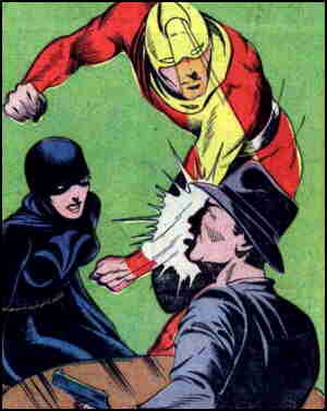 Scarlet delivers a left as Blackie looks on. Artist: George Tuska.