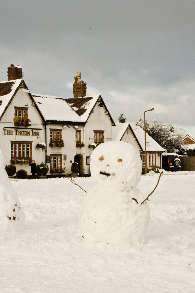 englishcottagedreams:
“Snow dude outside the pub gasping for a pint (by stesib)
”