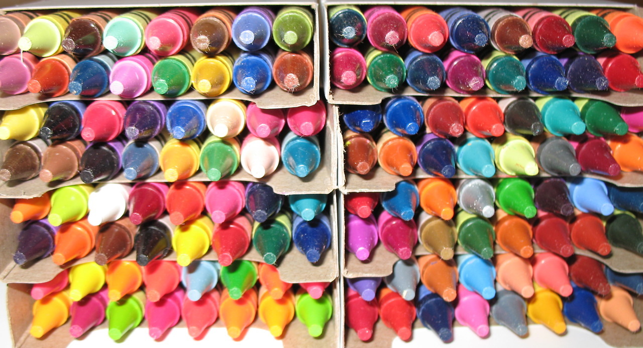 [ID: a large box of crayons, viewed from above to see all the points.]