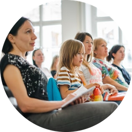 Image of women all seated in a row 