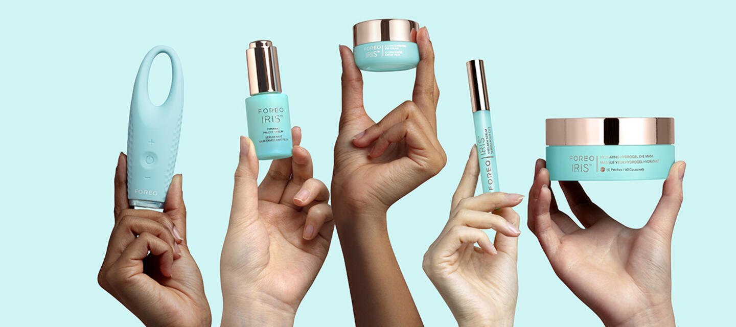 Hands holding FOREO IRIS eyecare product range