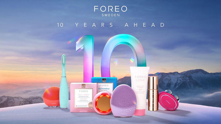 FOREO products on a hill with mountains in the background