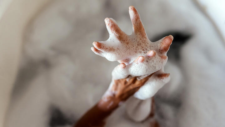 Woman's Hands in Bath