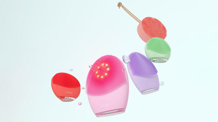 A range of FOREO LUNA facial brushes in various colors floating in white space