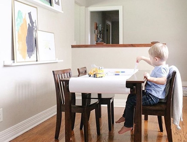 Child playing on table in art nook