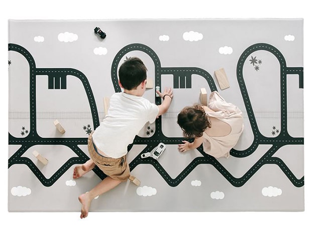 Kids playing on Ruggish Cali Memory Foam Reversible Play Mat.