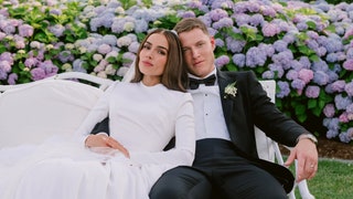Image may contain Christian McCaffrey Olivia Culpo Clothing Formal Wear Suit Blazer Coat Jacket Dress and Face