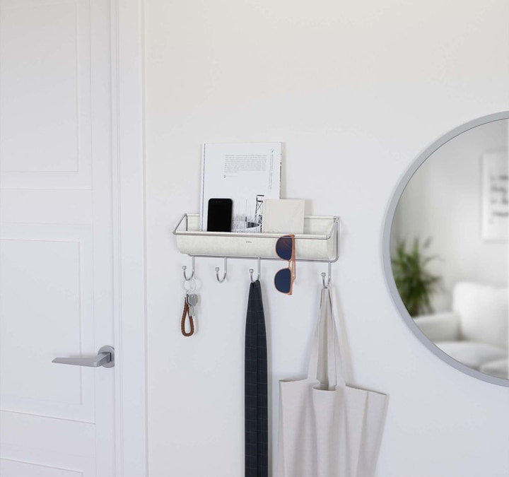 White hanging shelf with hooks.