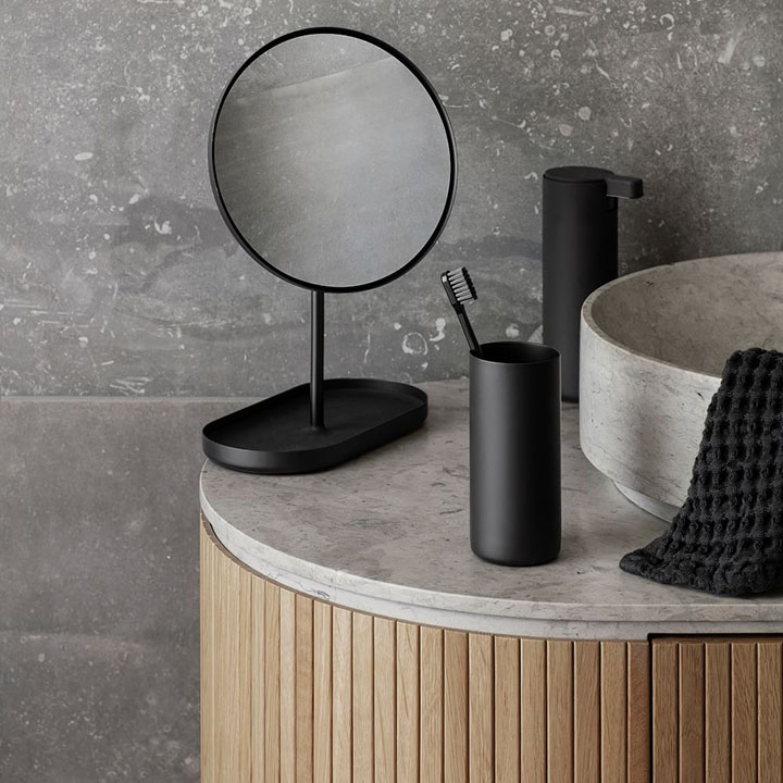 Black circular vanity mirror.