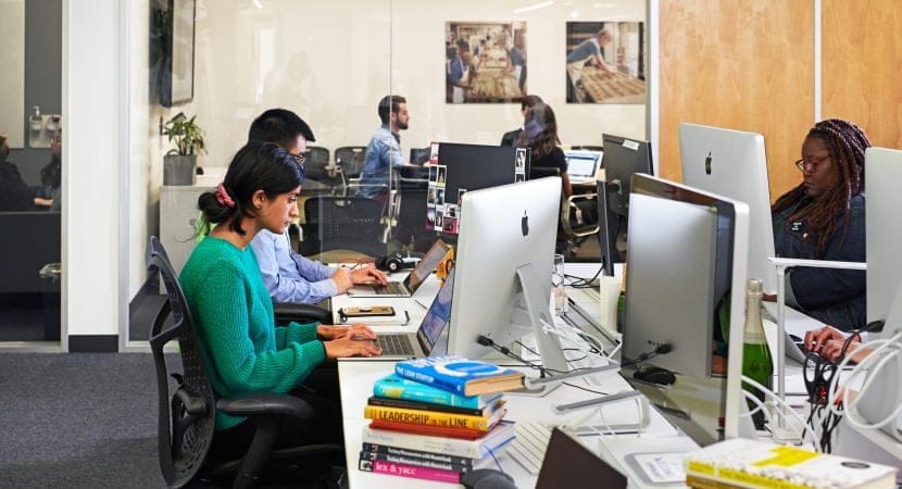 1 employee working from her desk in the office