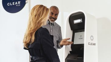 Two CLEAR users at a kiosk 