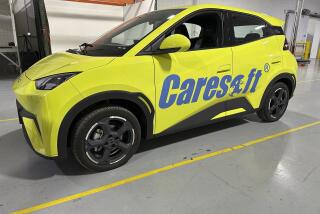 A BYD Seagull electric vehicle is displayed at the Caresoft Global facility Wednesday, April 3, 2024, in Livonia, Mich. Caresoft President Terry Woychowski, a former engineer at General Motors, said the Seagull represents a "clarion call" for the U.S. auto industry. (AP Photo/Mike Householder)