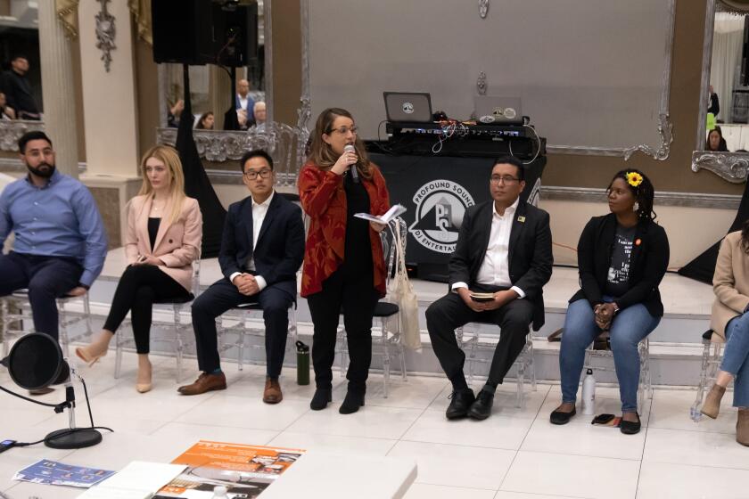 LOS ANGELES, CA - MARCH 02: City Council District 6 candidates Marco Santana, left, Rose Grigoryan, Isaac Kim, Imelda Padilla, Douglas Sierra, Antoinette Scully and Marisa Alcaraz answer audience questions during a debate at Platinum Banquet Hall in Panorama City, CA on Thursday, March 2, 2023. (Myung J. Chun / Los Angeles Times)