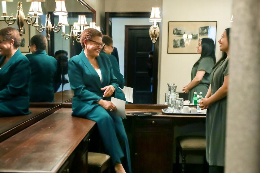 LOS ANGELES-CA - NOVEMBER 17, 2022: Karen Bass chats with her daughter Yvette Lechuga before making her election announcement at the Wilshire Ebell Theatre in Los Angeles on Thursday, November 17, 2022. (Christina House / Los Angeles Times)