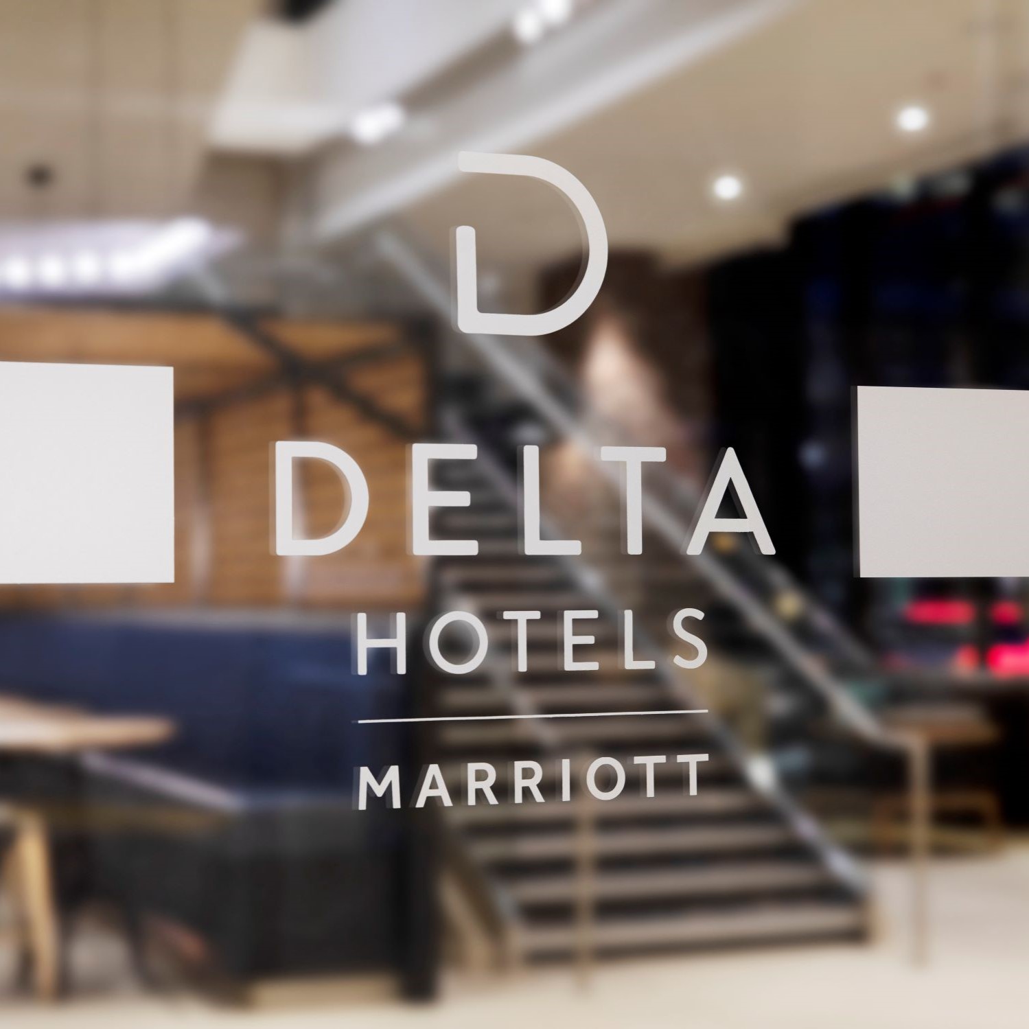 Delta Hotels logo with hotel lobby in the background.