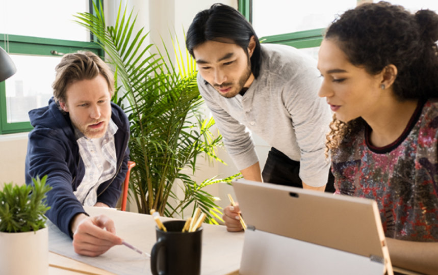 Small business team collaborating in modern workplace.