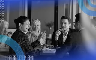 Employee relations image of a group of employees interacting and laughing in a casual atmosphere — maybe a coffee, lunch or happy hour.