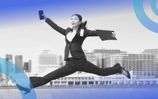 A woman jumping in the air. Bounce back from being fired by taking care of yourself and not rushing into another job.