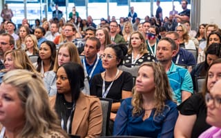 Photo of audience of DISH employees at a large presentation