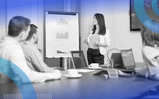 Salesperson giving a presentation in a boardroom