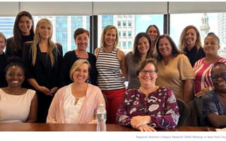 Group photo of NYC-based members of the DFIN Women’s Impact Network at a meetup event.