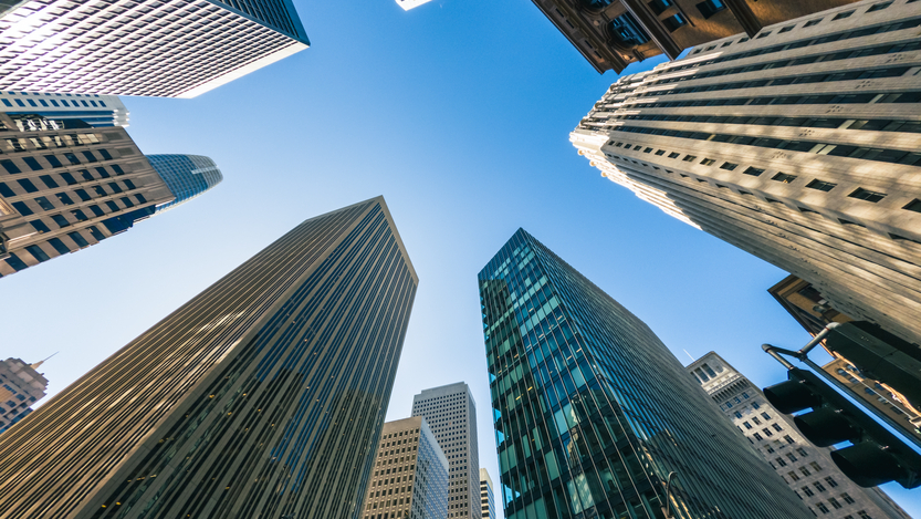 View of SF financial district skyscrapers from the group looking up as buildings tower overhead