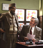 Citizen Khan. Image shows from L to R: Mr Khan (Adil Ray), Professor Stevens (James Fleet). Copyright: BBC