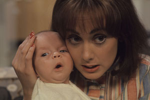 Miss Jones And Son. Image shows from L to R: Baby Roland (Luke Steensil), Elizabeth Jones (Paula Wilcox). Copyright: Thames Television