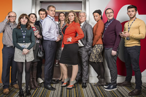 W1A. Image shows from L to R: Simon Harwood (Jason Watkins), Izzy Gould (Ophelia Lovibond), Tracey Pritchard (Monica Dolan), Will Humphries (Hugh Skinner), Ian Fletcher (Hugh Bonneville), Anna Rampton (Sarah Parish), Siobhan Sharpe (Jessica Hynes), Neil Reid (David Westhead), Lucy Freeman (Nina Sosanya), David Wilkes (Rufus Jones), Jack Patterson (Jonathan Bailey). Copyright: BBC