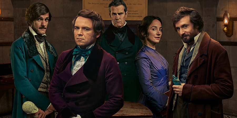 Quacks. Image shows from L to R: William (Mathew Baynton), Robert (Rory Kinnear), Dr. Hendrick (Rupert Everett), Caroline (Lydia Leonard), John (Tom Basden). Copyright: Lucky Giant