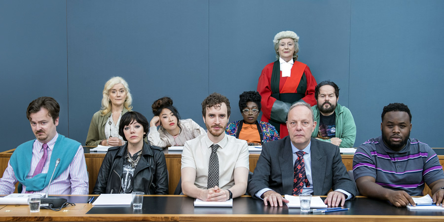 We The Jury. Image shows from L to R: Lucas (Oliver Maltman), Jen 1 (Sophie Thompson), Olivia (Diane Morgan), Sam (Kae Alexander), William (Edward Easton), Wolf (Vivienne Acheampong), Judge Henman (Maggie Steed), Mr Martin (David Schaal), Hugh (Kenneth Collard), Don (Samson Kayo). Copyright: Big Talk Productions