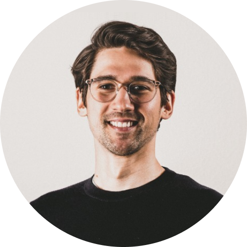 Headshot of a young caucasian businessman wearing glasses