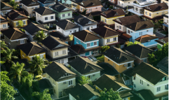 A bird's eye view of many houses in a neighborhood.