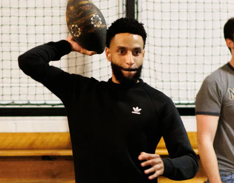 PrizePicks employee throwing a football