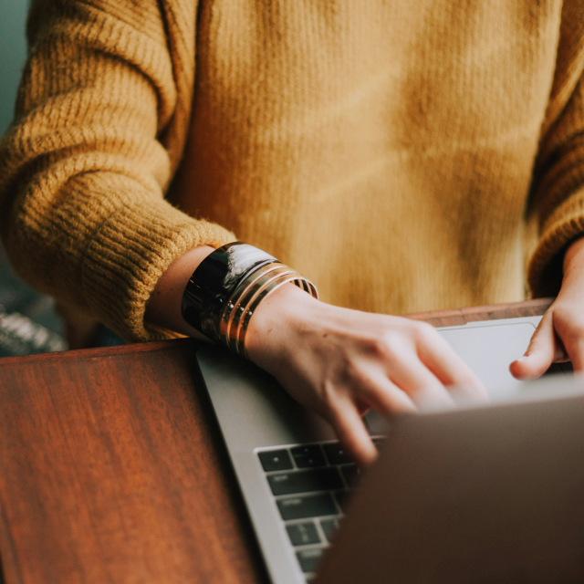 Yellow sweater laptop