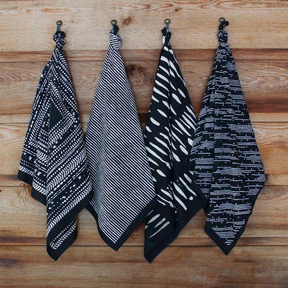 Bandana products hanging on wall hooks.