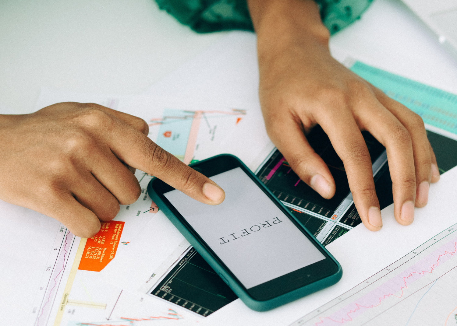 Close up of hands doing financial work on a calculator