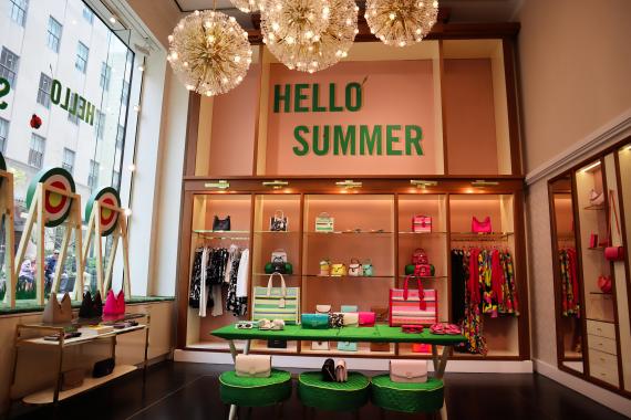 Kate Spade's store lighting enhances product visibility, highlights vibrant colors, and creates a welcoming summer ambiance.