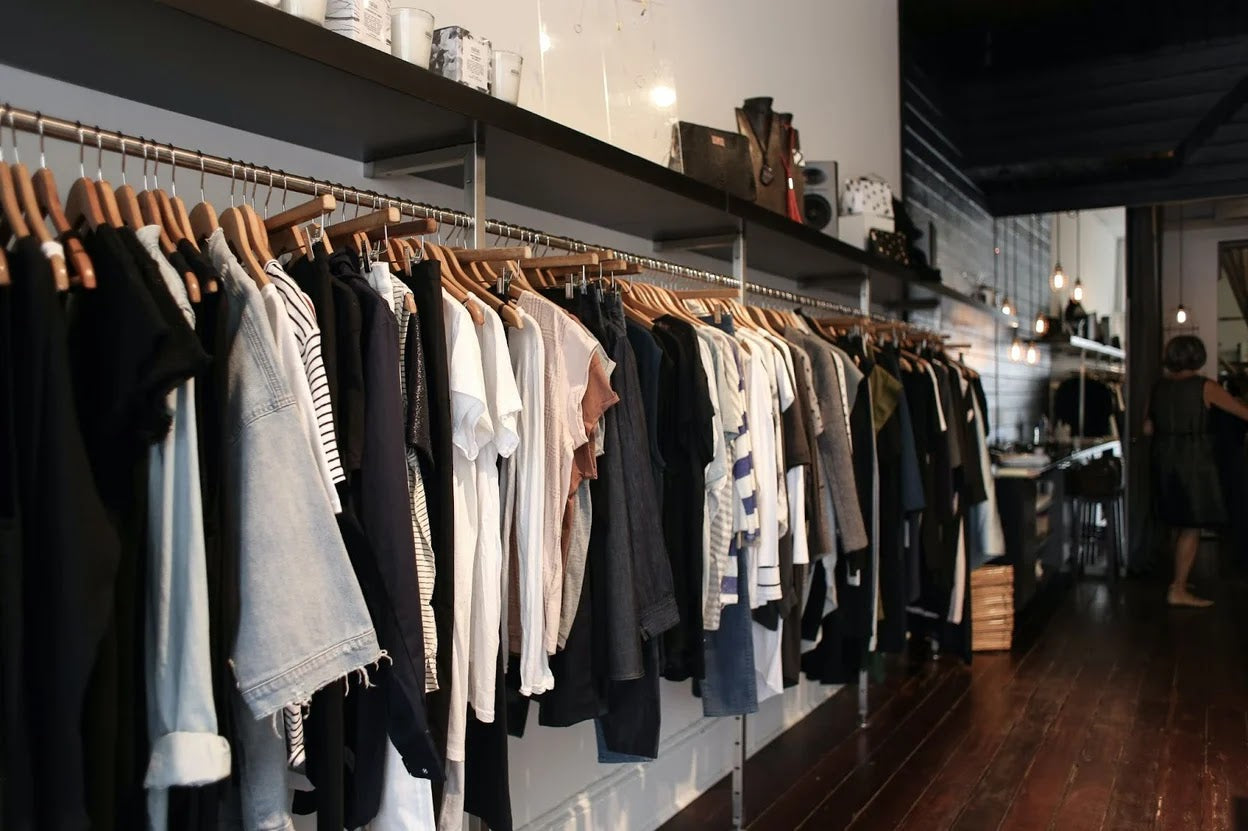 A rack of clothes in a clothing store.