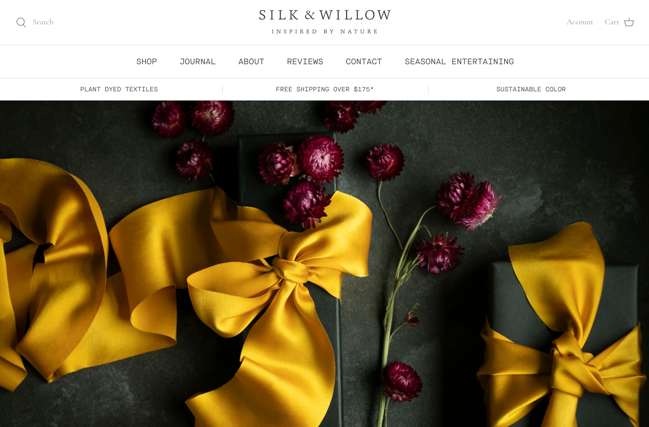 Silk and Willow's ecommerce website homepage featuring yellow ribbon and magenta flowers