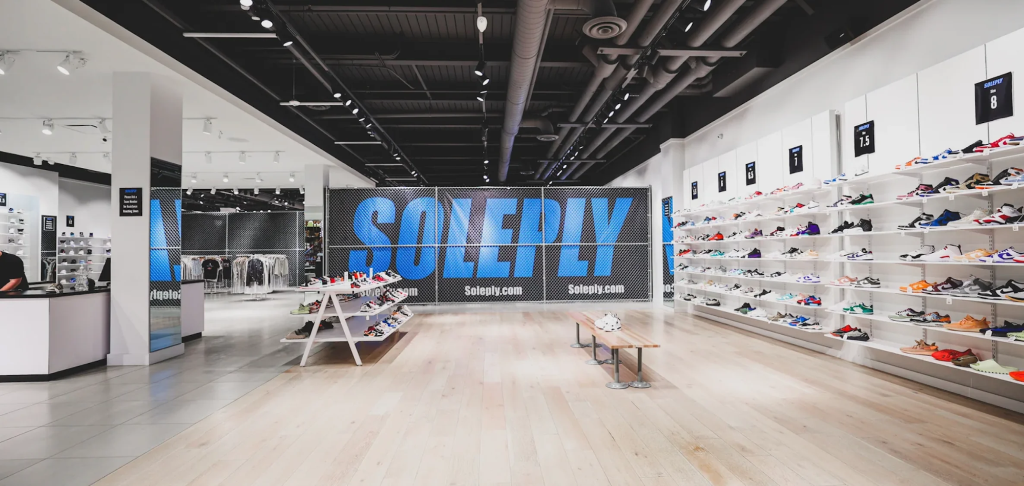 Shoe store with “Soleply” written in large blue text on the wall.