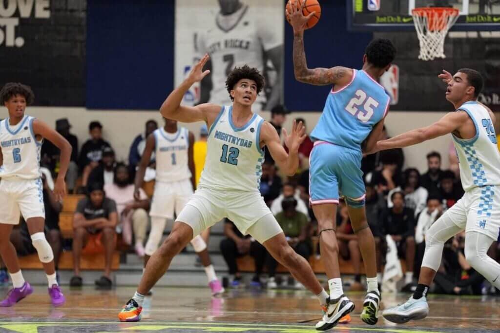 July 17, 2024; North Augusta, S.C., USA; Nightrydas Elite&#039;s Cameron Boozer (12) defends as Team Herro&#039;s Davion Hannah (25) looks to pass during the Nightrydas Elite and Team Herro game at the Nike Peach Jam at Riverview Park Activities Center. Nightrydas Elite won 88-58. Mandatory Credit: Katie Goodale-USA TODAY Network