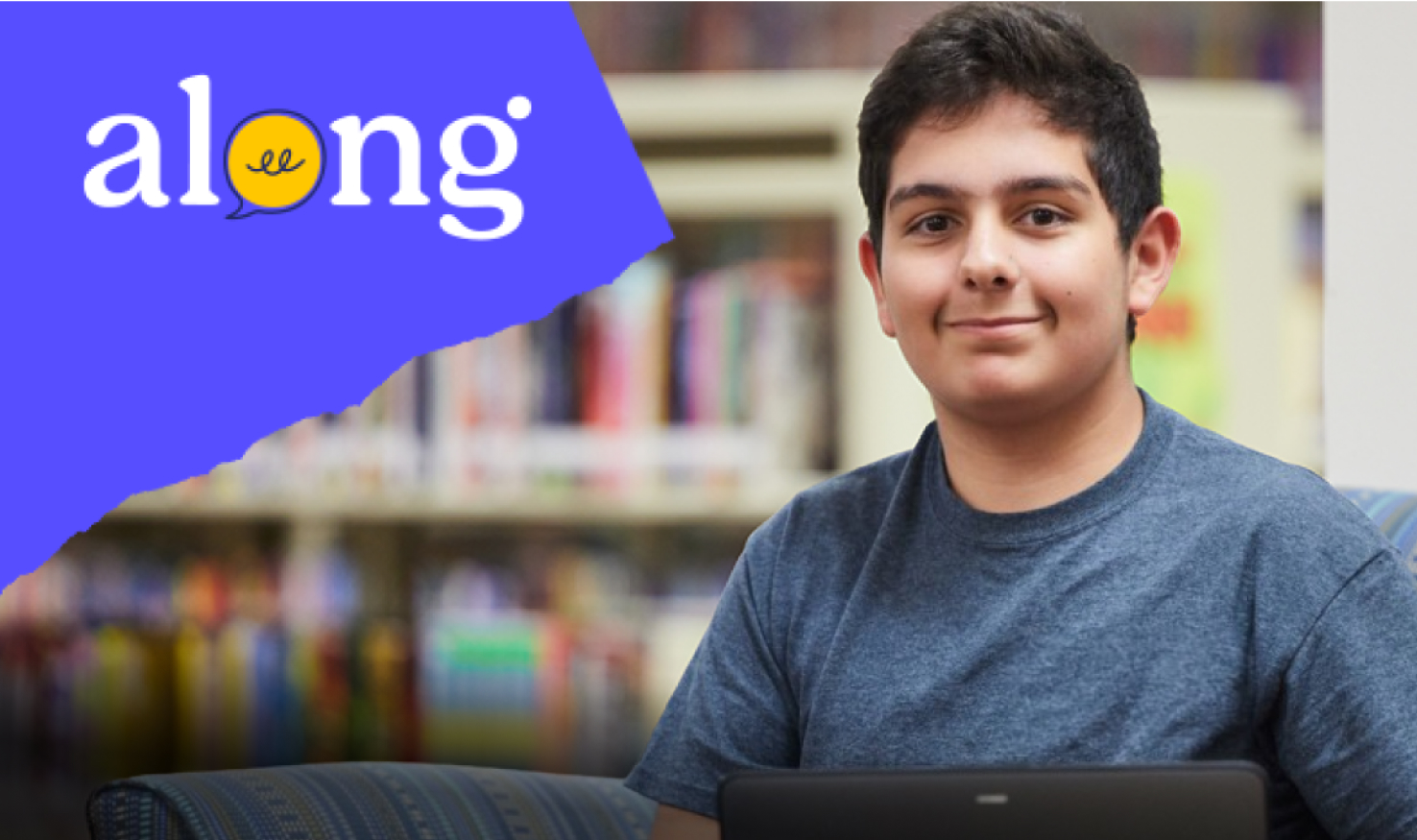 Smiling boy in classroom with Along logo.