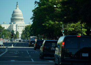 The motorcade carrying US President Joe Biden travels to the US Capitol in Washington, DC on October 1, 2021. - President Biden is heading to Congress to energize Democrats negotiating for a second day on getting his domestic spending agenda off the ground, or risk crippling political failure. The unusual presidential visit to Capitol Hill follows weeks of trips by party leaders in the other direction to the White House as Biden tries to get two ambitious spending plans passed into law. (Photo by MANDEL NGAN / AFP) (Photo by MANDEL NGAN/AFP via Getty Images)