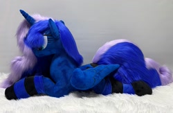 Size: 1280x836 | Tagged: safe, artist:melodis, princess luna, alicorn, pony, g4, clothes, folded wings, irl, lying down, photo, plushie, prone, socks, solo, striped socks, wings